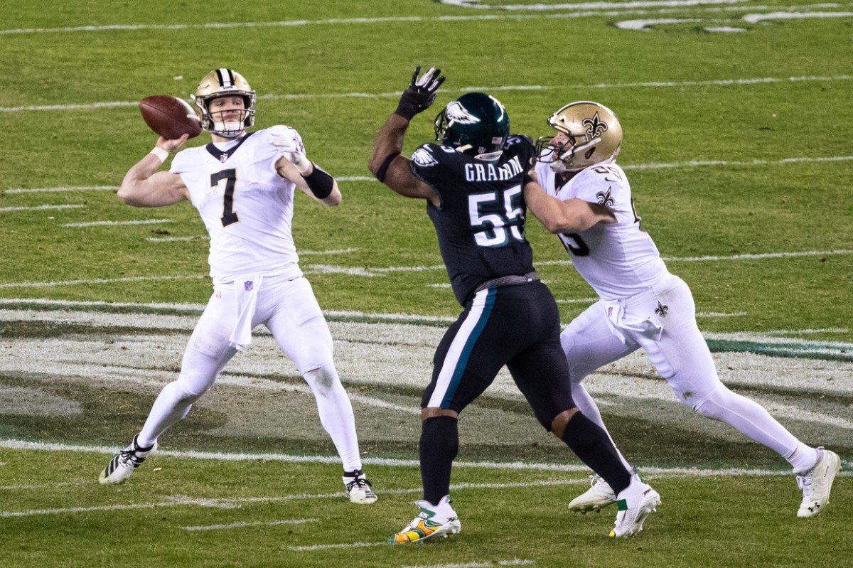 Dec 13, 2020; New Orleans Saints quarterback Taysom Hill (7) throws a pass pressured by Philadelphia Eagles defensive end Brandon Graham (55). Mandatory Credit: Bill Streicher-USA TODAY Sports